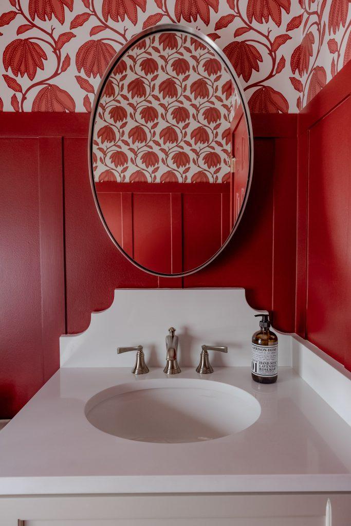 Red floral roman shade window treatment detail by Design House Interiors