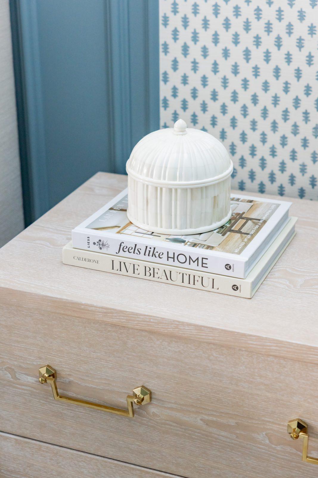 7L7A3139 Bedroom nightstand with decorative books, white dome, and brass hardware by Design House Interiors
